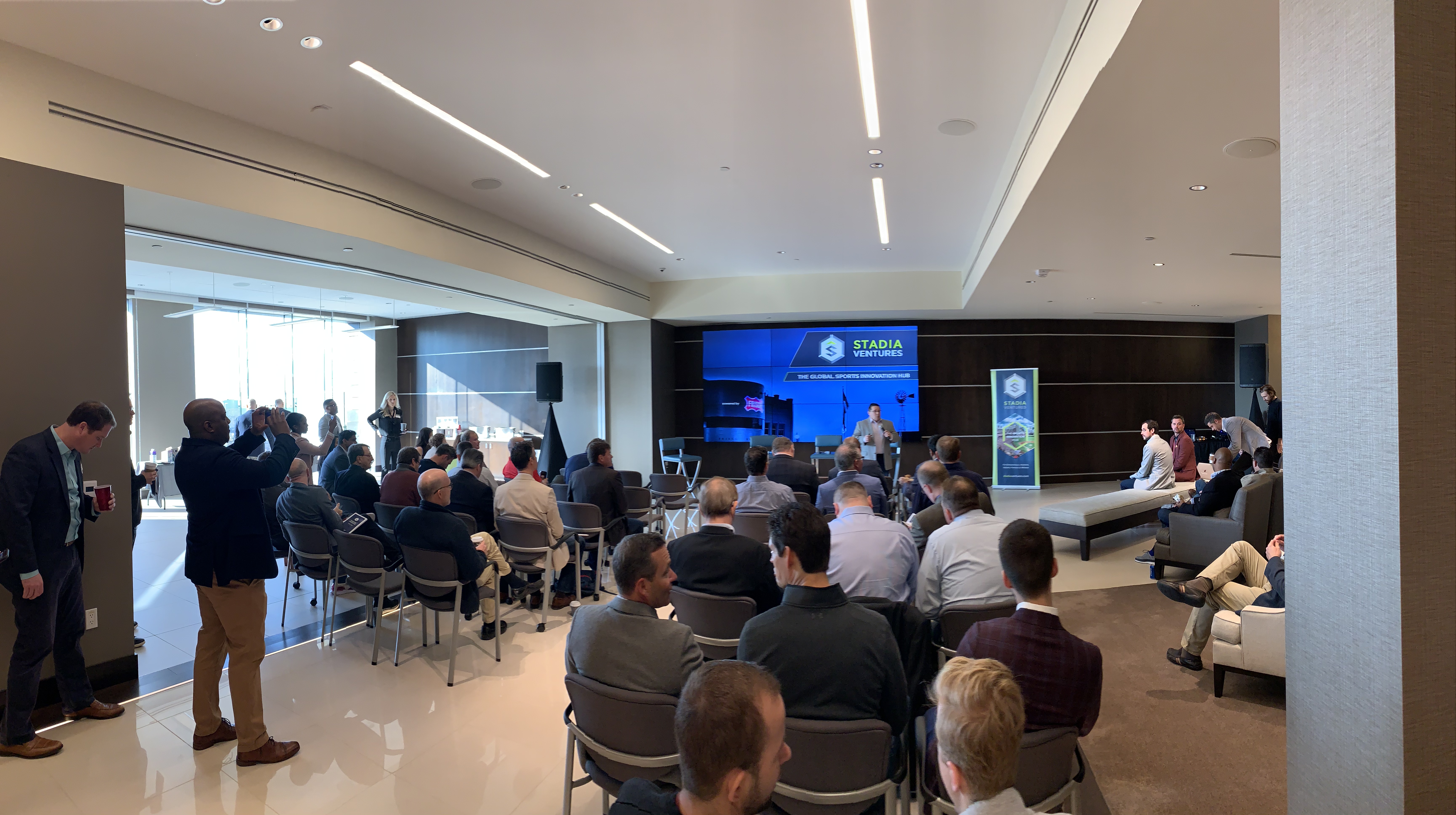 People gather for a media event for Stadia Ventures.